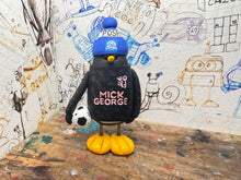 Load image into Gallery viewer, Peterborough United penguin away shirt 2026/27 with football and woolly hat