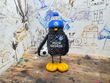 Load image into Gallery viewer, Peterborough United goalkeeper penguin 2023/2024 with football and woolly hat (black)