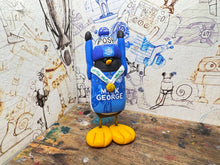 Load image into Gallery viewer, Peterborough United penguin 2025 shirt with vertu trophy winners 2025 on the back with woolly hat