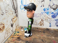 Load image into Gallery viewer, christian iddon cartoon character with moving head 2025