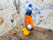 Load image into Gallery viewer, Peterborough United goalkeeper penguin 2024/25 with football and woolly hat (orange)