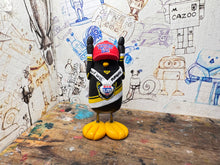 Load image into Gallery viewer, Nottingham Panthers playoff champions 2025 penguin with with medal and elite playoff champions 2025 on the back
