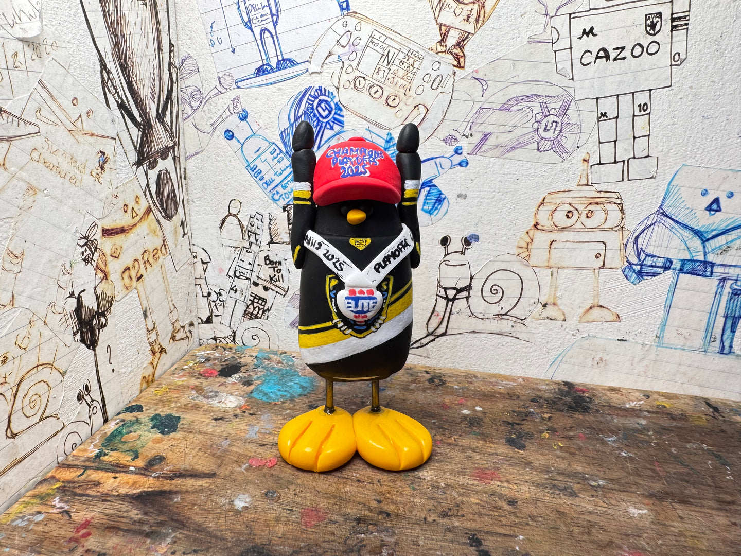 Nottingham Panthers playoff champions 2025 penguin with with medal and elite playoff champions 2025 on the back