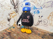 Load image into Gallery viewer, Peterborough United penguin away shirt 2026/27 with football and woolly hat
