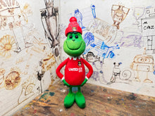 Load image into Gallery viewer, The Grinch in his wrexham shirt and woolly hat
