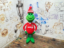 Load image into Gallery viewer, The Grinch in his wrexham shirt and woolly hat
