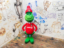 Load image into Gallery viewer, The Grinch in his wrexham shirt and woolly hat
