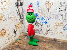 Load image into Gallery viewer, The Grinch in his wrexham shirt and woolly hat
