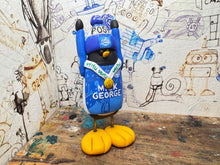 Load image into Gallery viewer, Peterborough United penguin 2025 shirt with vertu trophy winners 2025 on the back with woolly hat
