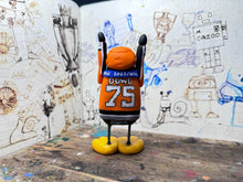 Load image into Gallery viewer, Sheffield Steelers Penguin home jersey with elite league champions 2024 medal / celebrating penguin with dowd 75 on the back
