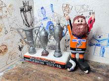 Load image into Gallery viewer, Sheffield Steelers cartoon character tansey 6 with medals / celebrating with removable trophies and Grand Slam base
