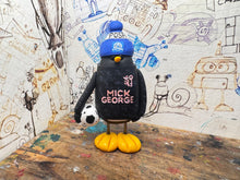 Load image into Gallery viewer, Peterborough United penguin away shirt 2026/27 with football and woolly hat

