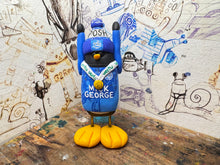 Load image into Gallery viewer, Peterborough United penguin 2025 shirt with vertu trophy winners 2025 on the back with woolly hat

