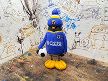 Load image into Gallery viewer, AFC Wimbledon penguin home shirt 2026/27 with football and woolly hat
