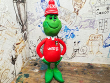 Load image into Gallery viewer, The Grinch in his wrexham shirt and woolly hat
