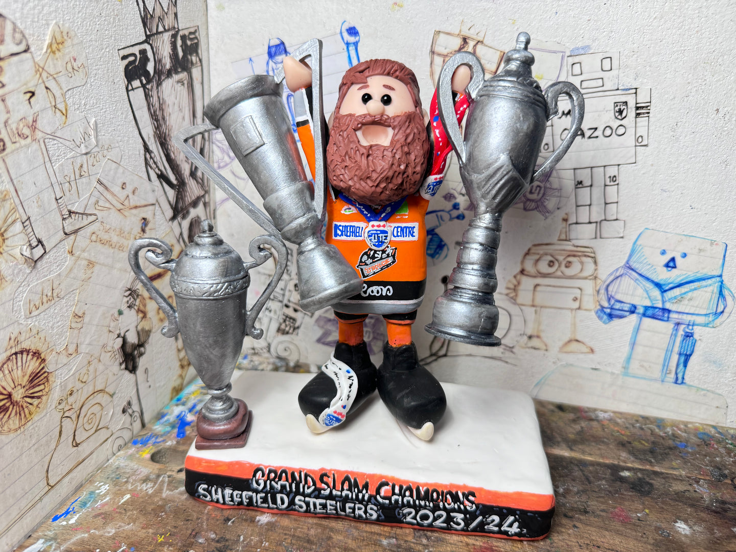 Sheffield Steelers cartoon character tansey 6 with medals / celebrating with removable trophies and Grand Slam base