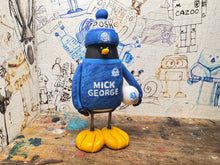 Load image into Gallery viewer, Peterborough United goalkeeper penguin 2025/2026 with football and woolly hat (blue)
